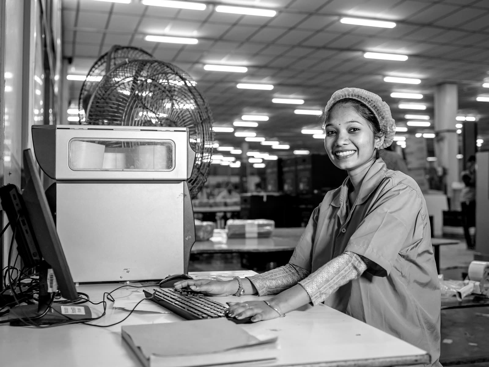 Operator working at a computer on a factory floor